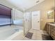 This bathroom features a walk-in shower and a separate soaking tub at 8019 Indian Creek Blvd, Kissimmee, FL 34747