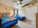 Bright bedroom with ceiling fan, two twin beds, Scooby Doo theme, and a closet at 8019 Indian Creek Blvd, Kissimmee, FL 34747