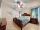 Bedroom showcasing fan, spacious closet, furniture, and a welcoming atmosphere at 8019 Indian Creek Blvd, Kissimmee, FL 34747