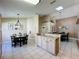 Open concept dining area and kitchen features tile floors and a skylight at 8019 Indian Creek Blvd, Kissimmee, FL 34747