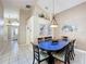 Dining area featuring a unique blue table and elegant decor at 8019 Indian Creek Blvd, Kissimmee, FL 34747