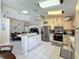 Spacious kitchen featuring stainless steel appliances, a breakfast bar, and access to dining area at 8019 Indian Creek Blvd, Kissimmee, FL 34747