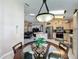 Open floor plan featuring an eat-in kitchen with stainless steel appliances and access to the dining area at 8019 Indian Creek Blvd, Kissimmee, FL 34747