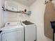 This laundry room features a side-by-side washer and dryer at 8019 Indian Creek Blvd, Kissimmee, FL 34747