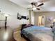 A main bedroom features decorative candle sconces and a TV at 8019 Indian Creek Blvd, Kissimmee, FL 34747