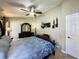 A ceiling fan adds air circulation to this attractive main bedroom at 8019 Indian Creek Blvd, Kissimmee, FL 34747