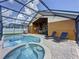 Beautiful pool area features a screened lanai, patio, and lounging furniture at 8019 Indian Creek Blvd, Kissimmee, FL 34747