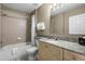 Neutral bathroom featuring granite countertops, tile flooring, a shower-tub combo and vanity at 8601 Worldquest Blvd # B1/U3502, Orlando, FL 32821