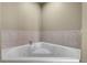 Close up of a soaking tub with tile surround at 8601 Worldquest Blvd # B1/U3502, Orlando, FL 32821