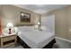 Cozy bedroom with a comfortable king-size bed, nightstands, lamps and closet at 8601 Worldquest Blvd # B1/U3502, Orlando, FL 32821