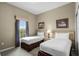 Comfortable bedroom featuring two twin beds and a bright window at 8601 Worldquest Blvd # B1/U3502, Orlando, FL 32821