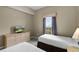 Light bedroom with two beds and a window at 8601 Worldquest Blvd # B1/U3502, Orlando, FL 32821