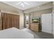 Spacious bedroom featuring a bed, dresser with TV, natural light and carpet floors at 8601 Worldquest Blvd # B1/U3502, Orlando, FL 32821
