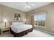 Comfortable bedroom featuring a king bed, nightstands, carpet floors and large window at 8601 Worldquest Blvd # B1/U3502, Orlando, FL 32821