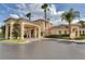 Exterior view of the community clubhouse with a covered entrance, sign and landscaping at 8601 Worldquest Blvd # B1/U3502, Orlando, FL 32821