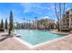 A large community pool with palm trees and lounge chairs providing a resort-style experience at 8601 Worldquest Blvd # B1/U3502, Orlando, FL 32821