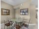 Dining room featuring a glass table and stylish chairs at 8601 Worldquest Blvd # B1/U3502, Orlando, FL 32821