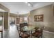 Dining room with table, chairs, and sliding doors to the balcony at 8601 Worldquest Blvd # B1/U3502, Orlando, FL 32821