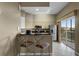 Bright kitchen with stainless steel appliances and granite countertops, and access to a balcony with a view at 8601 Worldquest Blvd # B1/U3502, Orlando, FL 32821
