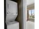 Convenient in-unit stacked washer and dryer with views to the bedroom at 8601 Worldquest Blvd # B1/U3502, Orlando, FL 32821