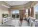 Living room featuring a TV, balcony, and comfortable seating at 8601 Worldquest Blvd # B1/U3502, Orlando, FL 32821