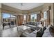 Bright living room with neutral tones and sliding doors to the balcony at 8601 Worldquest Blvd # B1/U3502, Orlando, FL 32821