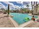 Large community pool featuring ample lounge chairs, lush landscaping, and sun-soaked relaxation at 8601 Worldquest Blvd # B1/U3502, Orlando, FL 32821