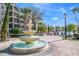 Beautiful water fountain and landscaping enhance the resort-style ambiance by the community pool at 8601 Worldquest Blvd # B1/U3502, Orlando, FL 32821