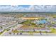 Beautiful aerial view of the neighborhood, showing community amenities including pool, landscaping and other neighborhood homes at 971 Paradise Dr, Davenport, FL 33897