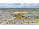 Aerial view of townhomes in a resort-style community, with a pool, landscaping and beautiful neighborhood at 971 Paradise Dr, Davenport, FL 33897