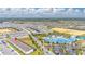 Stunning aerial view of the resort-style community and its many homes, amenities and lush landscaping at 971 Paradise Dr, Davenport, FL 33897