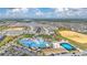 Beautiful aerial view of the neighborhood, showing community amenities including pool, basketball court and other neighborhood homes at 971 Paradise Dr, Davenport, FL 33897