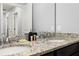 Bathroom with double sink vanity, granite countertop, and ample counter space at 971 Paradise Dr, Davenport, FL 33897