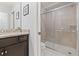 Stylish bathroom with a glass-enclosed shower, and vanity with granite countertop at 971 Paradise Dr, Davenport, FL 33897