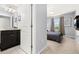 The bedroom features a view into the bathroom and modern decor, enhancing the space at 971 Paradise Dr, Davenport, FL 33897