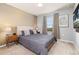 Charming bedroom featuring calming colors, bedside tables, and a TV for relaxation at 971 Paradise Dr, Davenport, FL 33897