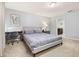 Spacious bedroom with a desk area, soft carpet, and access to the bathroom at 971 Paradise Dr, Davenport, FL 33897