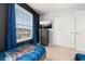 Comfortable bedroom with accent wall, matching furniture, and ample natural light at 971 Paradise Dr, Davenport, FL 33897