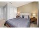 Relaxing bedroom with neutral colors, comfortable bedding, and modern bedside tables at 971 Paradise Dr, Davenport, FL 33897