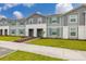 Inviting townhomes with well-maintained lawns, creating a pleasant and appealing street view at 971 Paradise Dr, Davenport, FL 33897