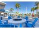 Cozy fire pit surrounded by blue Adirondack chairs, creating a relaxing gathering space within the community amenities area at 971 Paradise Dr, Davenport, FL 33897