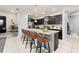 Beautiful kitchen featuring granite countertops, stainless steel appliances, and a spacious island with bar seating at 971 Paradise Dr, Davenport, FL 33897