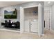 Convenient laundry closet features a stacked washer and dryer for efficient space-saving at 971 Paradise Dr, Davenport, FL 33897