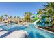 Resort-style lazy river featuring lush landscaping, slides, and a bridge for endless summer fun at 971 Paradise Dr, Davenport, FL 33897