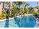 Lush landscaping surrounds the peaceful lazy river at this resort-style community at 971 Paradise Dr, Davenport, FL 33897