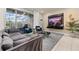 Stylish living room with a comfortable sofa, modern decor, and access to an outdoor patio at 971 Paradise Dr, Davenport, FL 33897