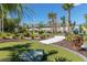 A unique mini golf course with a pelican statue, lush tropical landscaping, and synthetic turf offers a recreational amenity at 971 Paradise Dr, Davenport, FL 33897