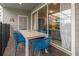 Covered patio includes an outdoor dining set overlooking the pool at 971 Paradise Dr, Davenport, FL 33897