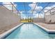 Private screened pool with brick patio and views of the neighborhood at 971 Paradise Dr, Davenport, FL 33897