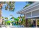 Resort-style pool area with colorful water slides and a cabana bar at 971 Paradise Dr, Davenport, FL 33897